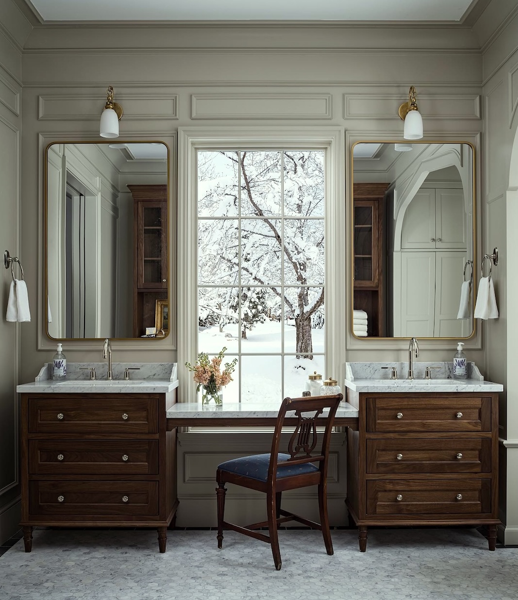 bathroom-with-a-window-between-two-vanities-in-a-new-tudor-Steve Tiek - Architect