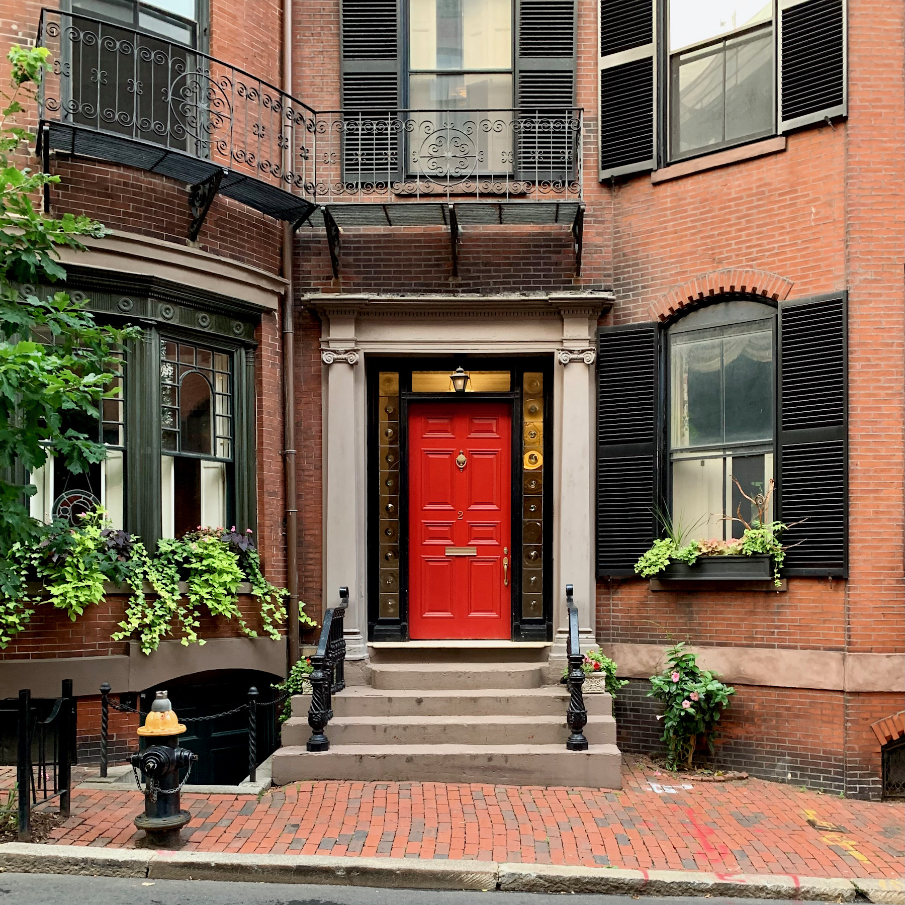 Stunning red doors of Beacon Hill - black shutters - balcony